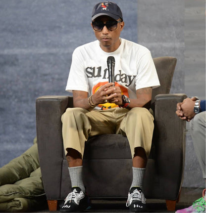 Pharrell Williams (celebrity) wearing the Cactus Plant Flea Market (CPFM) tee shirt at his interview